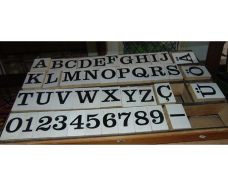 A vintage assembly of approximately 41 timber printing blocks with rubber pads and painted faces, alpha numeric, all containe