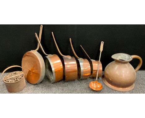 Copper and metal ware - a 19th century copper Blancher pan;  a graduated set of four copper and cast iron saucepans, the larg
