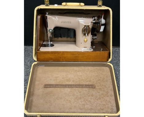 A Vintage Singer Sewing machine, serial number EM251054, cased.