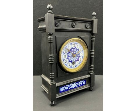 An Arts-and-Crafts/Aesthetic Movement mantel clock, circular blue and white floral enamelled dial, brass mounts, ebonised cas