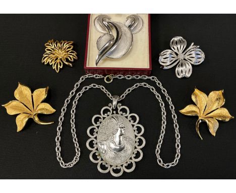 Trifari costume jewellery, including a pendant and earrings suite, a portrait pendant, floral spray brooches, etc; other simi