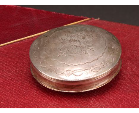 A 19th century Dutch silver circular snuff or peppermint box, engraved with wrigglework, 5.5cm diam, c.1840