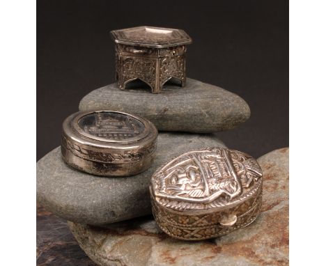 An Egyptian silver circular box, the cover embossed with a view of the Mosque of Muhammed Ali, Cairo, 4cm diam; another, as a