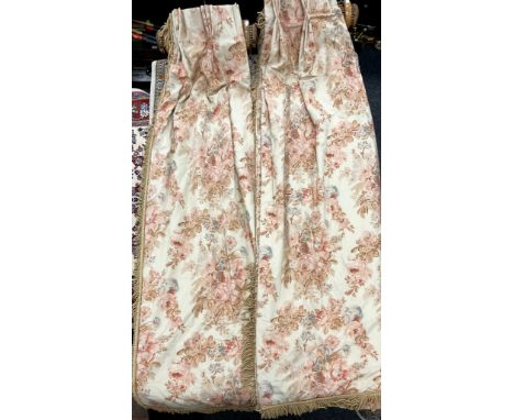 A pair of reversible interlined curtains, with bouquets of roses and swag garlands, cream peach ground, weighted bottom, rope