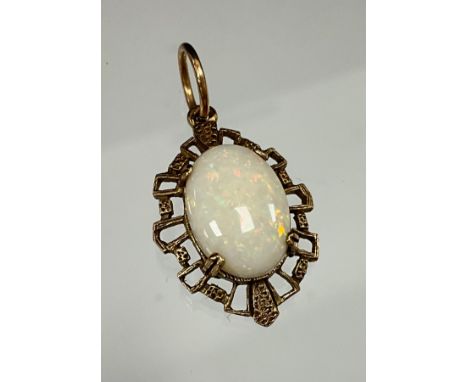 An oval opal pendant, flashing strong red, green, violet and orange play, 9ct gold mount, approx 2.5cm x 1.5cm, 2.5g gross