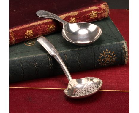 A George III silver caddy spoon, the bowl engine turned with a chequered panel, outlined throughout with wrigglework, 9cm lon