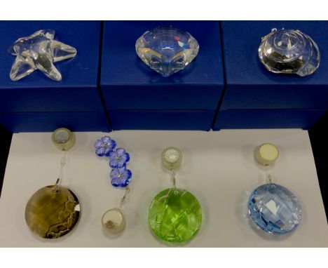 Swarovski Crystal ornaments including; Sun catcher ornaments in colours; blue, green and Smokey, Shells, Artic flower, all bo