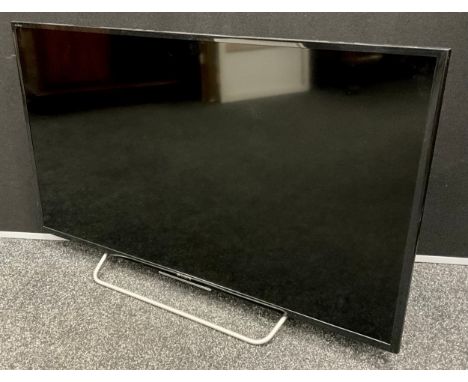 A Sony Bravia 40” TV, model no. KDL-40W705C, with remote control, and user manual.