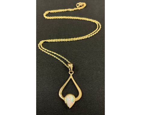 A 9ct gold opal pendant necklace, with single pear drop cabochon opal, mount stamped 9k, 3cm drop, suspended from a fine link