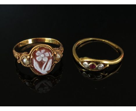 A gold ring stamped 18ct (worn) set with ruby and diamonds and a carved floral cameo ring