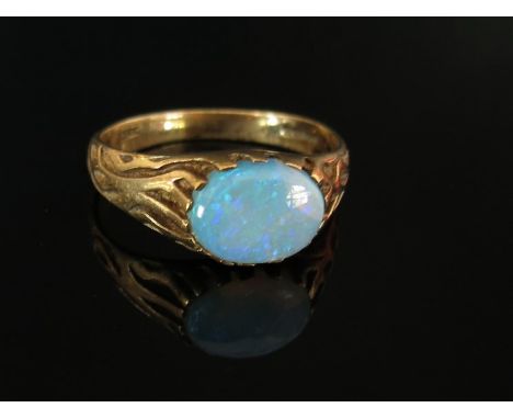 A 9ct gold ring set with oval opal in east-west setting, size M, 2.7g