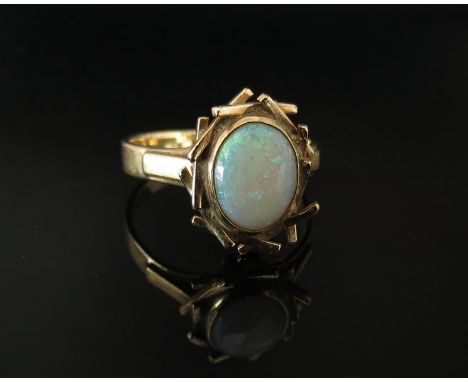 A 9ct gold opal set ring in modernistic mount. Size L, 2.7g