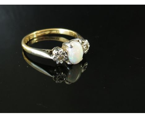 An opal and illusion set diamond ring stamped 18ct, size L, 3.1g 