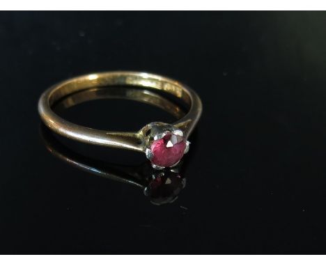 An 18ct gold platinum set ruby solitaire ring. Size M, 1.9g