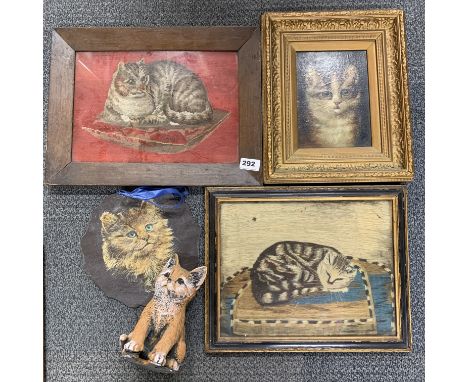 A gilt framed oil on canvas of a cat together with an early framed tapestry. With a further cat painted on slate with a furth