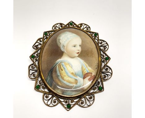 A 19thC filligree mounted watercolour portrait miniature of a young girl, signed Van Dyck. With gilt monogram on the reverse,