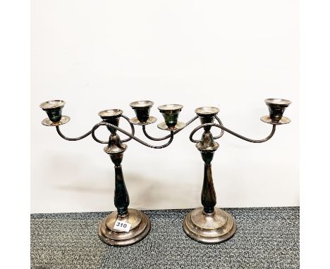 A pair of silverplated candelabra, H. 32cm.
