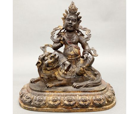 A Tibetan cold painted bronze figure of a guardian deity, H. 29cm.