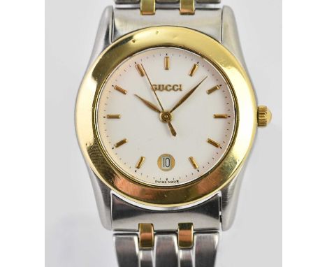 Standard VAT GUCCI; a lady's bimetallic stainless steel wristwatch, with baton markers and date aperture to the circular dial