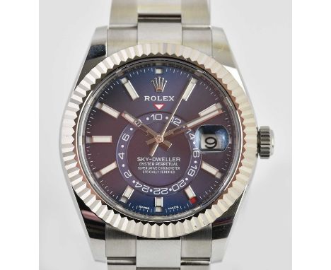 Standard VAT ROLEX; a gentleman's stainless steel Oyster Perpetual Sky-Dweller wristwatch, with two piece blue dial, Oyster b