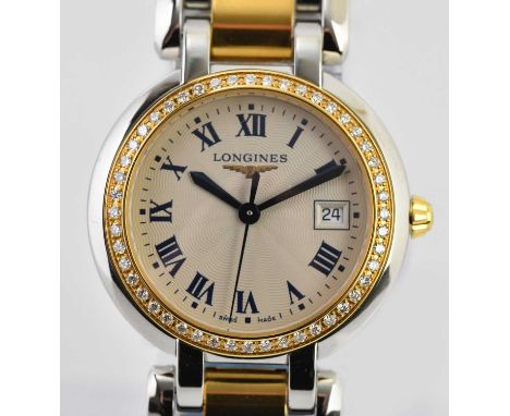 Standard VAT LONGINES; a lady's bimetallic Prima Luna wristwatch, with Roman numerals and date aperture to the circular dial,