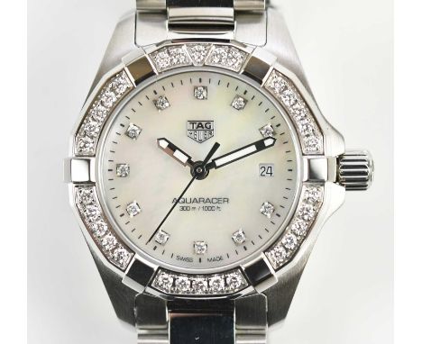 Standard VAT TAG HEUER; a lady's Aquaracer wristwatch with mother of pearl dial, diamond set to the hour markers and with dia