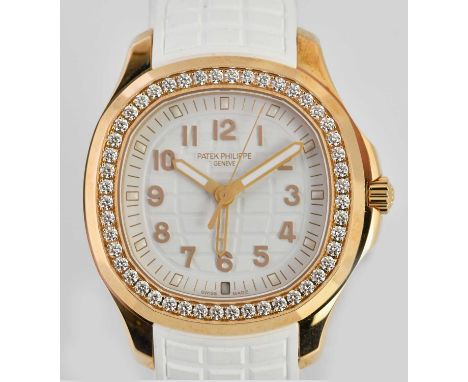 Standard VAT PATEK PHILIPPE; a lady's 18ct rose gold Aquanaut Luce Travel Time wristwatch, with white dial, round brilliant c