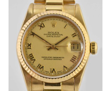 Standard VAT ROLEX; a lady's 18ct yellow gold Oyster Perpetual Datejust wristwatch, with Roman numerals to the circular dial,