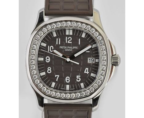 Standard VAT PATEK PHILIPPE; a lady's stainless steel Aquanaut wristwatch, with brown dial, the bezel set with forty-six diam