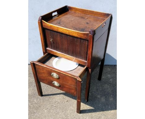A Georgian mahogany tray-top commode with twin handles, tambour front, original pot in pull out base raised on square chamfer