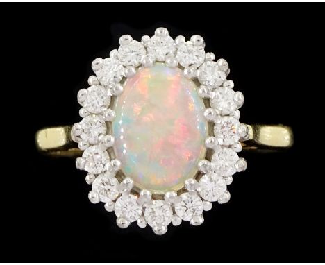 18ct gold opal and round brilliant cut diamond cluster ring, hallmarked, opal 0.66 carat, total diamond weight 0.36 caratCond