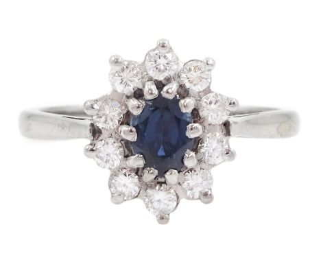 18ct white gold oval cut sapphire and round brilliant cut diamond cluster ring, London 1973, sapphire approx 0.50 carat, tota