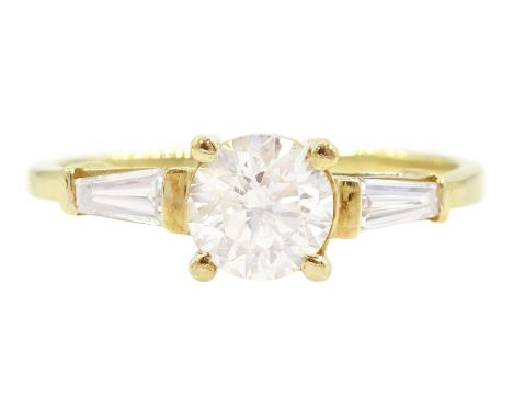 18ct gold single stone round brilliant cut diamond ring, with tapered baguette diamond shoulders, stamped 750, principal diam