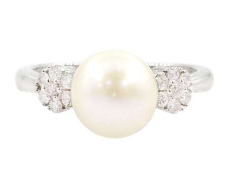 9ct white gold pearl and diamond ring, the central white cultured pearl, with two clusters of round brilliant cut diamonds ei