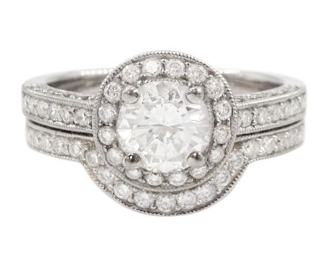Platinum single stone round brilliant cut diamond ring, with pave set diamond surround, gallery and shoulders, principal diam