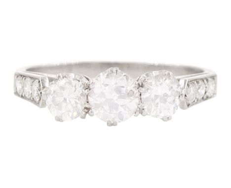 Early 20th century platinum three stone old cut diamond ring, with diamond set shoulders, total diamond weight approx 1.20 ca