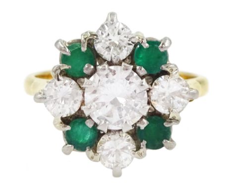 18ct gold emerald and diamond cluster ring, the central round brilliant cut diamond of approx 0.80 carat, with four stone rou