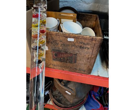 An old box containing various collectables including Royal commemorative ware, together with a glass thermometer. 