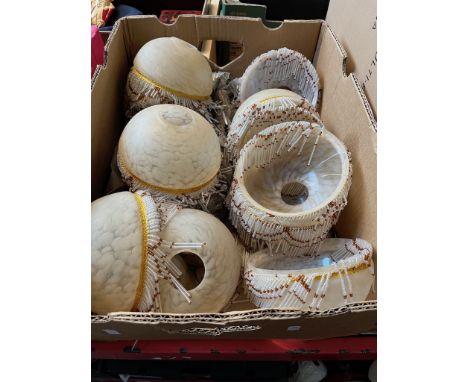 A box of vintage vaseline lamp / light shades with beaded frills. 