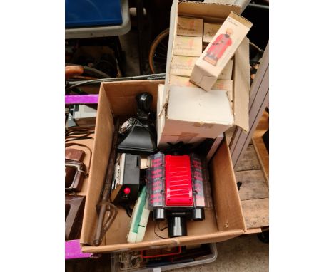 A box of collectables to include Ottoman figures, a Maverick slot machine, 2 money banks, a V8 engine model, a repro dagger a