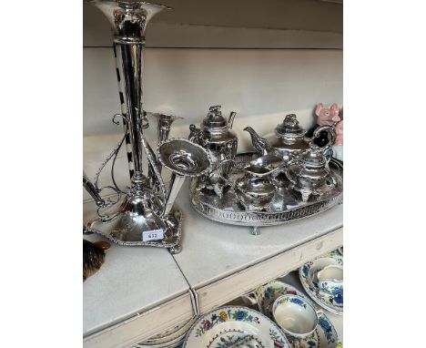 A silver plate epergne, height appx 41cm, a plated oval tray with 4 piece plated tea set