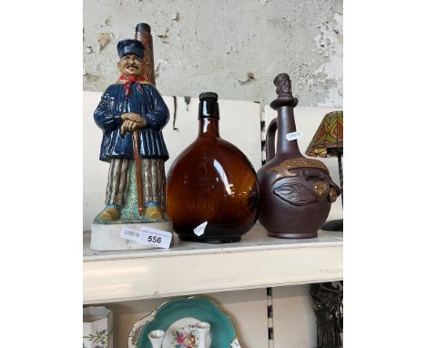 Three vintage decanters, including Keystone Whisky, a 1978 KLEM Dutch style Italian decanter and a Calvados decanter, all wit