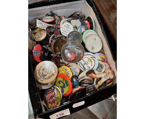 A box of vintage pin badges 