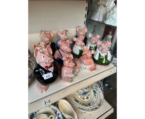 A collection of 11 Nat West ceramic pigs, all with stoppers, various duplicates 