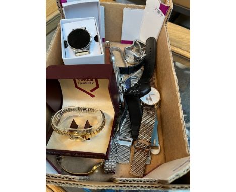 A box containing various watches including Timex, Sekonda, Accurist, Casio, Addidas. 