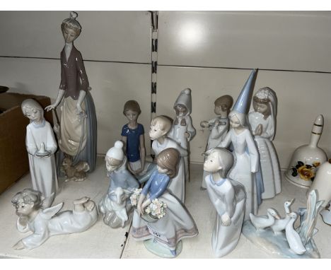 11 Lladro figures, various sizes. One has a damaged hand. Also 2 Nao figures 