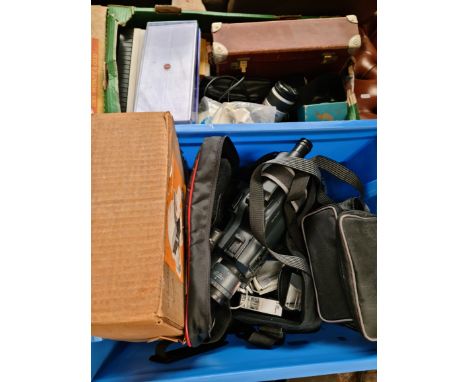 2 boxes of cameras to include video cameras, Minolta, slides and film editing equipment. 