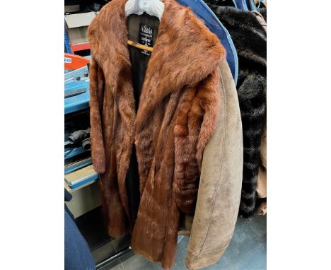 A sheepskin coat and a vintage fur coat. 