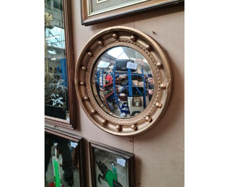 A vintage gilt framed convex mirror, 20th century. 