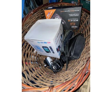 A basket containing Satnavs, camera etc. 